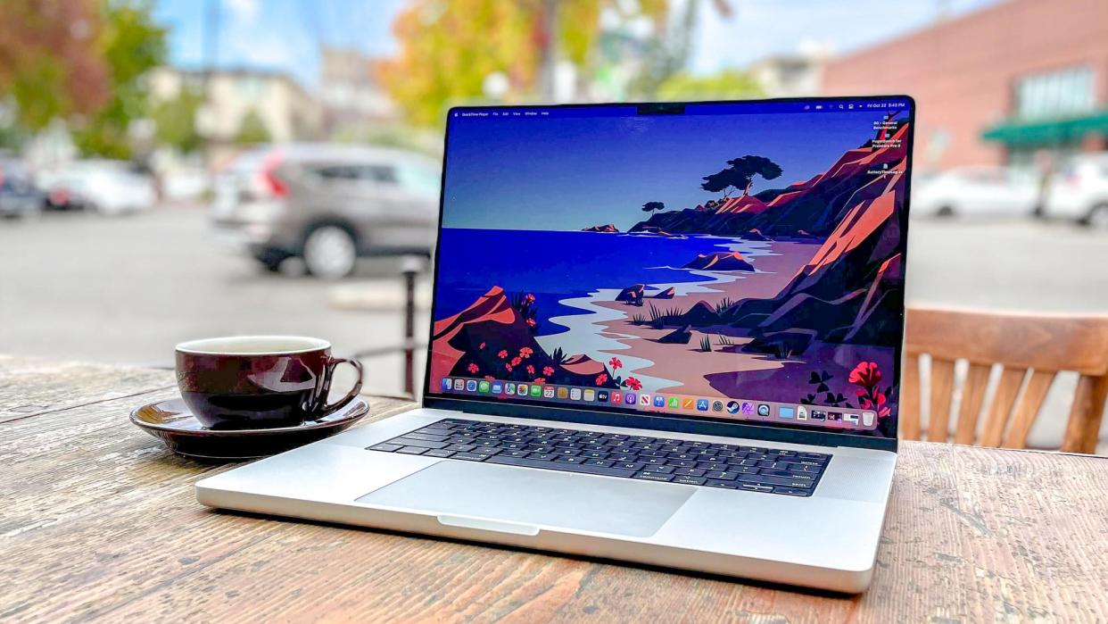  MacBook Pro 16-inch 2021 sitting on a patio table. 