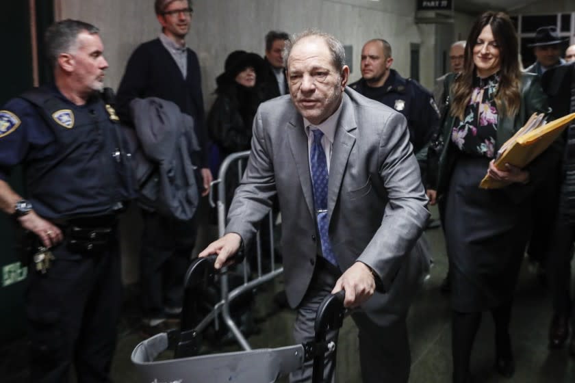 Harvey Weinstein leaves a Manhattan courthouse during his rape trial, Tuesday, Feb. 18, 2020, in New York. (AP Photo/John Minchillo)