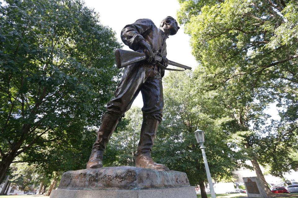 FILE - This Sept. 19, 2017, file photo shows a Confederate monument honoring Henry Lawson Wyatt at the state Capitol in Raleigh, N.C. News outlets report that crews Saturday morning, June 20, 2020 were removing this and another statue in the area dedicated to the women of the Confederacy. (AP Photo/Gerry Broome, File)