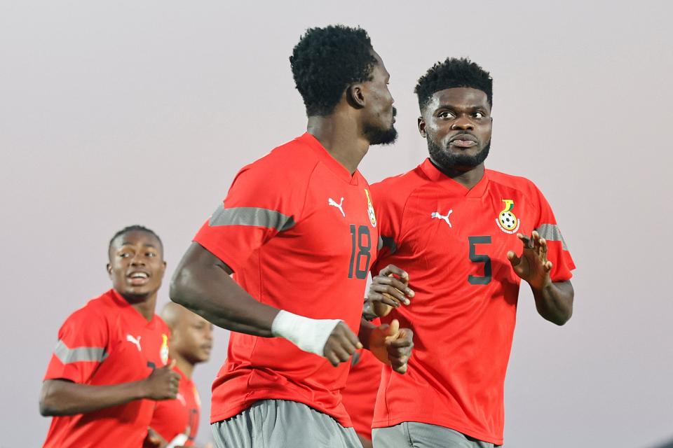 Arsenal midfielder Thomas Partey (right) starts for Ghana (AFP via Getty Images)