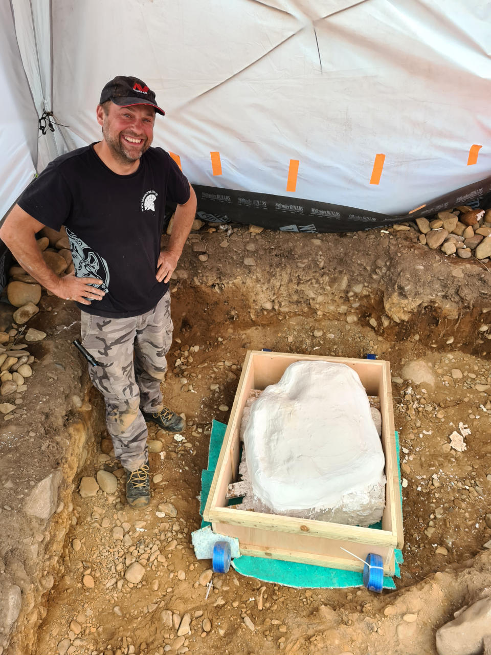 Mariusz Stepien stands next to the hoard ready for transport back to Edinburgh. (Crown Office Communications/PA Wire)