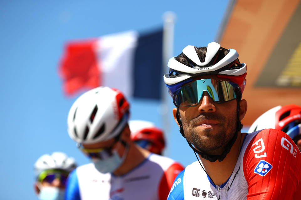 Thibaut Pinot at the Tour de France, in front of a French flag