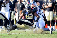 <p>Alec Ogletree #52 of the Los Angeles Rams tackles Mark Ingram #22 of the New Orleans Saints on the third down during the second quarter of the game at the Los Angeles Memorial Coliseum on November 26, 2017 in Los Angeles, California. (Photo by Harry How/Getty Images) </p>