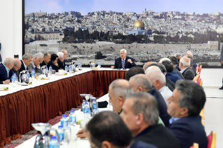 Palestinian President Mahmoud Abbas gestures as he speaks during a meeting with the Palestinian leadership in Ramallah, in the occupied West Bank March 19, 2018. Palestinian President Office (PPO)/Handout via REUTERS