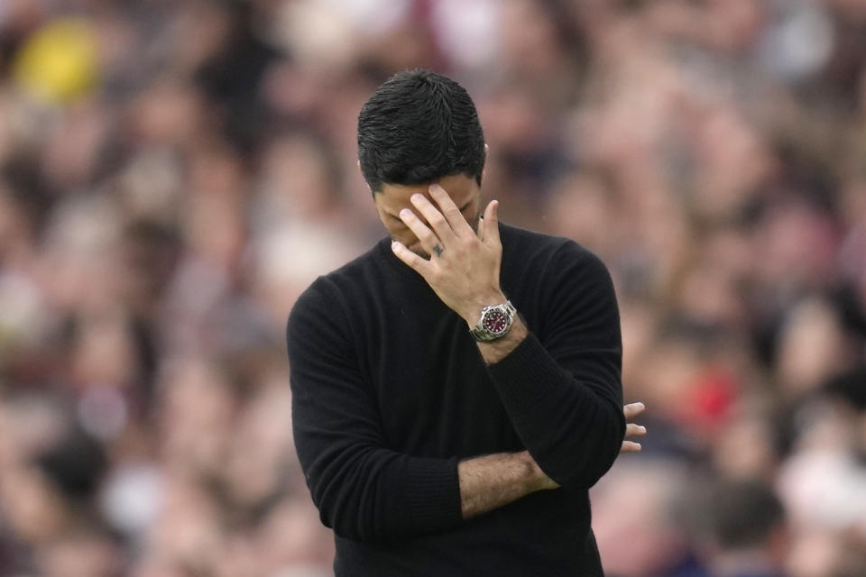 Arsenal's manager Mikel Arteta reacts after Brighton's Julio Enciso scored his side's opening goal during the English Premier League soccer match between Arsenal and Brighton and Hove Albion at Emirates stadium in London, Sunday, May 14, 2023. (AP Photo/Kirsty Wigglesworth)