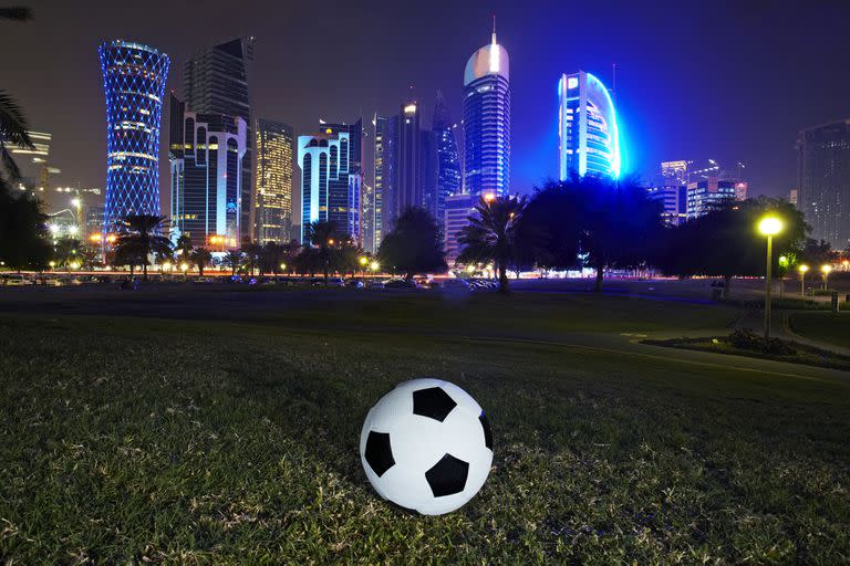 Football and skyline of the West Bay Doha. Qatar is set to stage the 2022 world cup football tournament, the first Middle east country to do so.