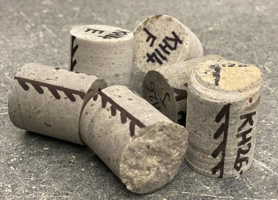 A few rock core samples, with the sample orientation line marked on their sides. Craig Robert Martin, <a href="http://creativecommons.org/licenses/by-nd/4.0/" rel="nofollow noopener" target="_blank" data-ylk="slk:CC BY-ND;elm:context_link;itc:0;sec:content-canvas" class="link ">CC BY-ND</a>