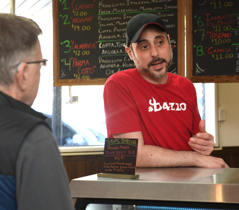 Biazzo Deli is a new Italian sandwich shop in downtown Landrum. The owner of the shop Brian Frascino, center, talks to a guest. .