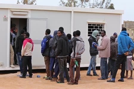 A group of Senegalese illegal immigrants, who according to authorities will be deported back to Senegal through the border with Tunisia, are held at the Alkarareem immigration centre in the east of Misrata February 26, 2015. REUTERS/Stringer