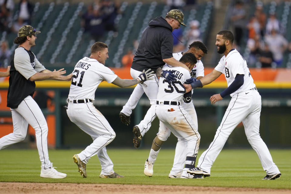 Detroit Tigers' Harold Castro (30) celebrates his game winning single against the Chicago Cubs in the 10th inning of a baseball game in Detroit, Saturday, May 15, 2021. Detroit won 9-8. (AP Photo/Paul Sancya)