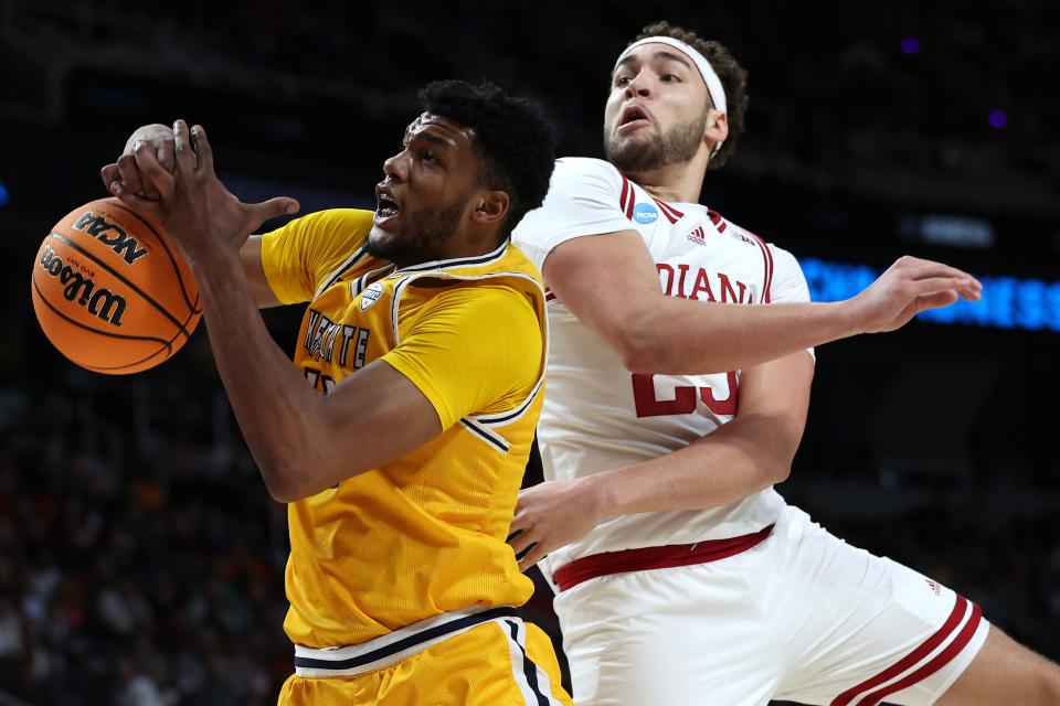 Race Thompson (25) of Indiana defends Cli'Ron Hornbeak (42) of Kent State in the first half of a first-round NCAA Tournament game at MVP Arena on March 17, 2023 in Albany, New York.