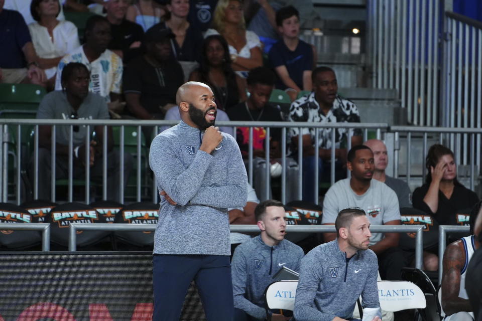 In a photo provided by Bahamas Visual Services, Villanova head coach Kyle Neptune, center, looks on during the first half of an NCAA college basketball game against Memphis in the Battle 4 Atlantis at Paradise Island, Bahamas, Friday, Nov. 24, 2023. (Ronnie Archer/Bahamas Visual Services via AP)