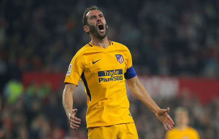 Soccer Football - Spanish King's Cup - Quarter Final Second Leg - Sevilla vs Atletico Madrid - Ramon Sanchez Pizjuan, Seville, Spain - January 23, 2018 Atletico Madrid's Diego Godin reacts after missing a chance to score REUTERS/Jon Nazca