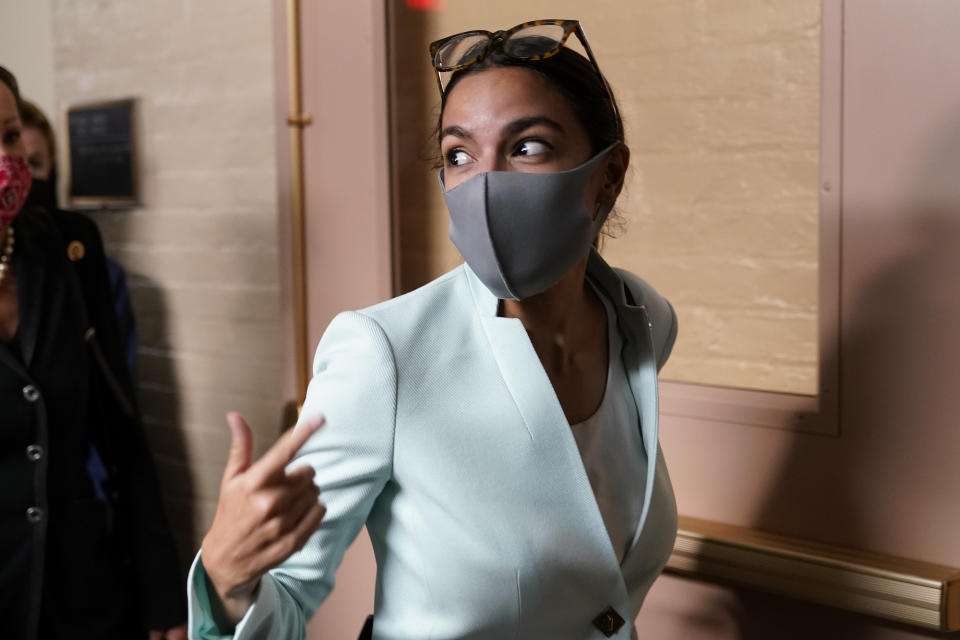 Rep. Alexandria Ocasio-Cortez, D-N.Y., departs after attending a meeting with President Joe Biden and the House Democratic Caucus on Capitol Hill in Washington, Friday, Oct. 1, 2021. (AP Photo/Patrick Semansky)