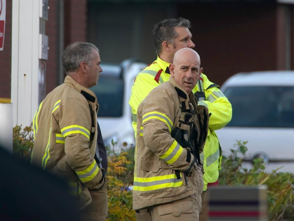 Fire officers are pictured outside the hospital earlier (PA)