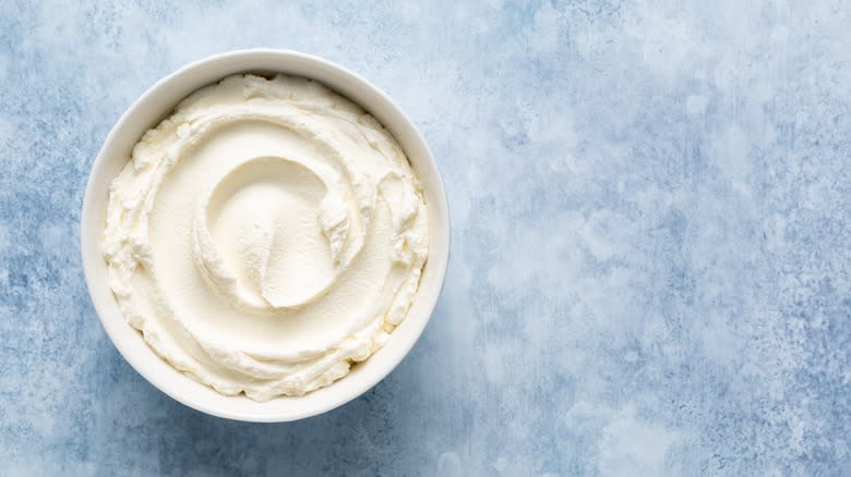 Cream cheese on blue surface