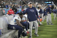 Tennessee Titans offensive tackle Nicholas Petit-Frere is consoled by staff late in the second half of an NFL football game, Saturday, Jan. 7, 2023, in Jacksonville, Fla. The Jaguars won 20-16. (AP Photo/Phelan M. Ebenhack)