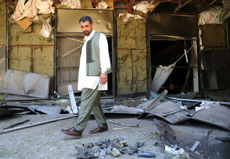 A man walks in front of Rixos hotel damaged by a rocket in Tripoli, Libya May 24, 2019. REUTERS/Goran Tomasevic