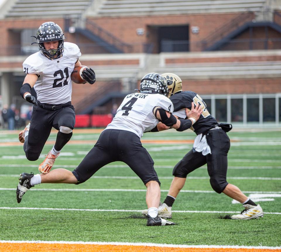 As Gage Dunker seals off his guy, Lena-Winslow's Jake Zeal finds an opening for the 2-point conversion against Camp Point Central on Friday, Nov. 25, 2022, at University of Illinois in Champaign.