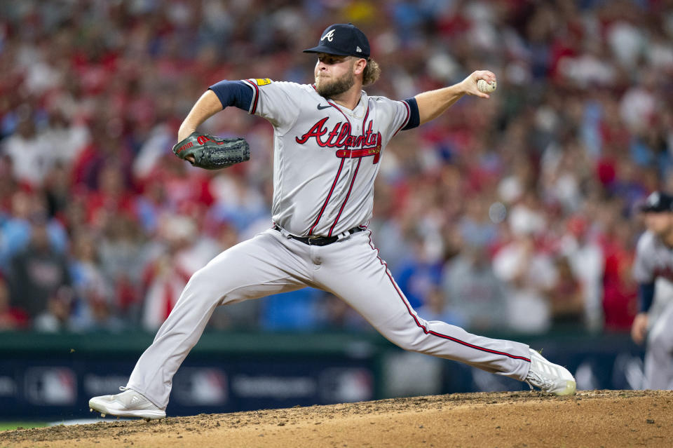 FILE - Atlanta Braves relief pitcher A.J. Minter throws during Game 4 of a baseball NL Division Series against the Philadelphia Phillies, Thursday, Oct. 12, 2023, in Philadelphia. The Atlanta Braves have signed their last arbitration-eligible players by agreeing to deals with left-hander Max Fried and A.J. Minter. The Braves announced Thursday, Jan. 11, 2024, signing one-year deals with Fried for $15 million and Minter for $6.22 million.(AP Photo/Chris Szagola, File)