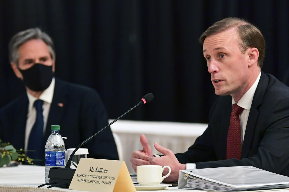 Secretary of State Antony Blinken, left, listen as national security adviser Jake Sullivan, right, speaks at the opening session of US-China talks at the Captain Cook Hotel in Anchorage, Alaska, Thursday, March 18, 2021. (Frederic J. Brown/Pool via AP)