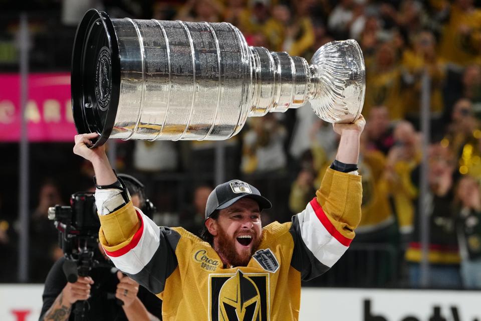 Vegas Golden Knights forward Jonathan Marchessault, who won the Conn Smythe Trophy given to the playoff MVP, hoists the Stanley Cup.