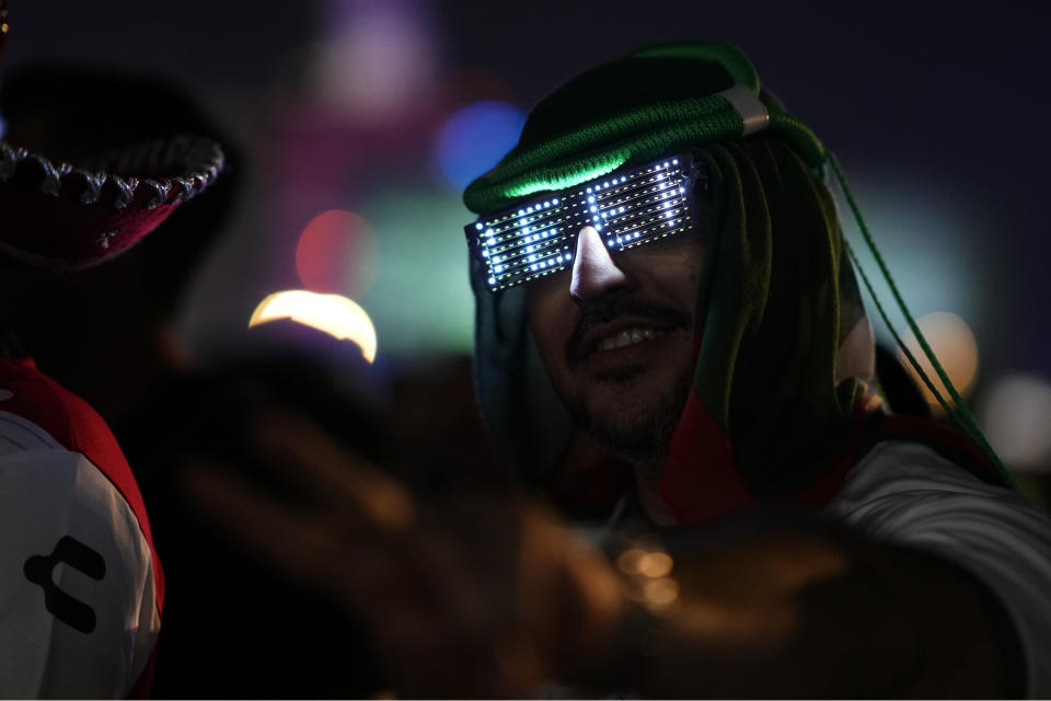 Fan wait line for a beer at a fan zone ahead of the FIFA World Cup, in Doha, Qatar Saturday, Nov. 19, 2022. (AP Photo/)