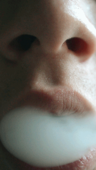 GIF of woman vaping