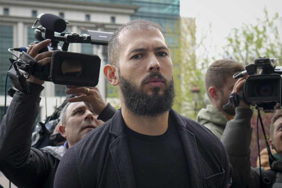 Andrew Tate arrives at the Bucharest Tribunal, in Bucharest, Romania, Friday, April 21, 2023. The brothers' attendance on Friday comes after they won an appeal on March 31 to be moved from police custody to house arrest, where they will remain until at least April 29. (AP Photo/Vadim Ghirda)