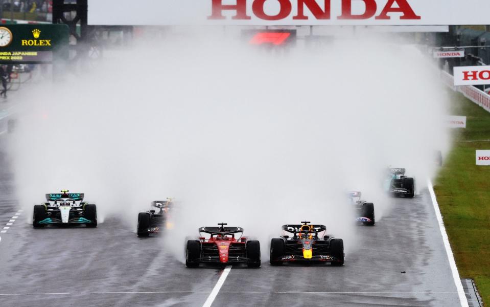 Max Verstappen of the Netherlands driving the (1) Oracle Red Bull Racing RB18 and Charles Leclerc of Monaco driving the (16) Ferrari F1-75 battle for track position into turn one at the start during the F1 Grand Prix of Japan at Suzuka International Racing Course on October 09, 2022 in Suzuka, Japan - Getty Images 