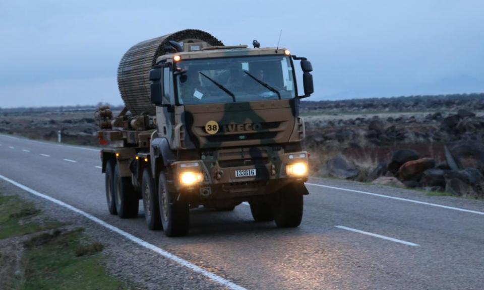 A Turkish military vehicle heads towards Syria’s Afrin region.