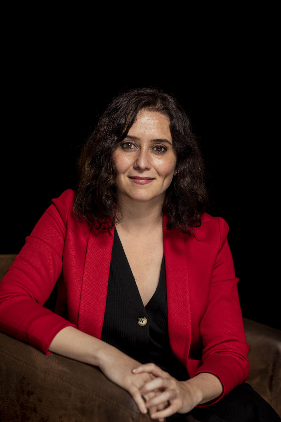 FILE - Isabel Diaz Ayuso poses for a portrait during an interview with The Associated Press in Madrid, Spain, April 26, 2021. A Spanish judge has opened an investigation for alleged fraud and false documentation against the sentimental partner of Madrid's powerful rightwing regional president, Isabel Diaz Ayuso. Ayuso, who is seen as a possible future party leader and prime minister candidate, has come under fire in recent months on several fronts but news reports of treasury investigations into alleged tax fraud by her partner has led opposition parties to call for her immediate resignation. (AP Photo/Bernat Armangue, File)