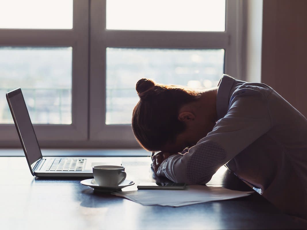 Tired woman at desk