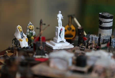 Miniature figures carved by Palestinian diorama artist Majdi Abu Taqeya using remnants of Israeli ammunition collected from the scenes of border protests along the Israel-Gaza border are seen in the central Gaza Strip March 11, 2019. Picture taken March 11, 2019. REUTERS/Ibraheem Abu Mustafa