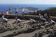 Spectators watch the riders in the Eze pass during the second stage of the Tour de France cycling race over 186 kilometers (115,6 miles) with start and finish in Nice, southern France, Sunday, Aug. 30, 2020. (AP Photo/Thibault Camus)