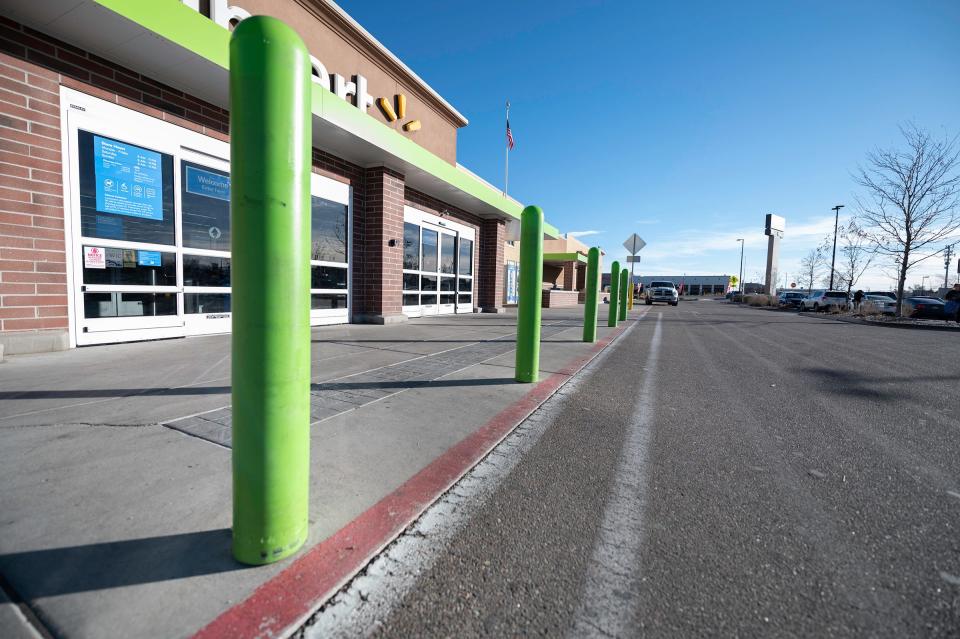 A row of bollards protect the entrance of the Walmart Neighborhood Market on the southside of Pueblo.