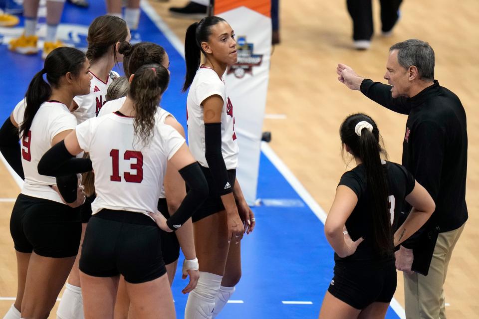Nebraska coach John Cook talks to his team during Thursday night's win over Pittsburgh in the NCAA semifinals. The Cornhuskers' lone loss this season was a 3-0 sweep on Nov. 24 by Wisconsin, which Texas eliminated on Thursday night.