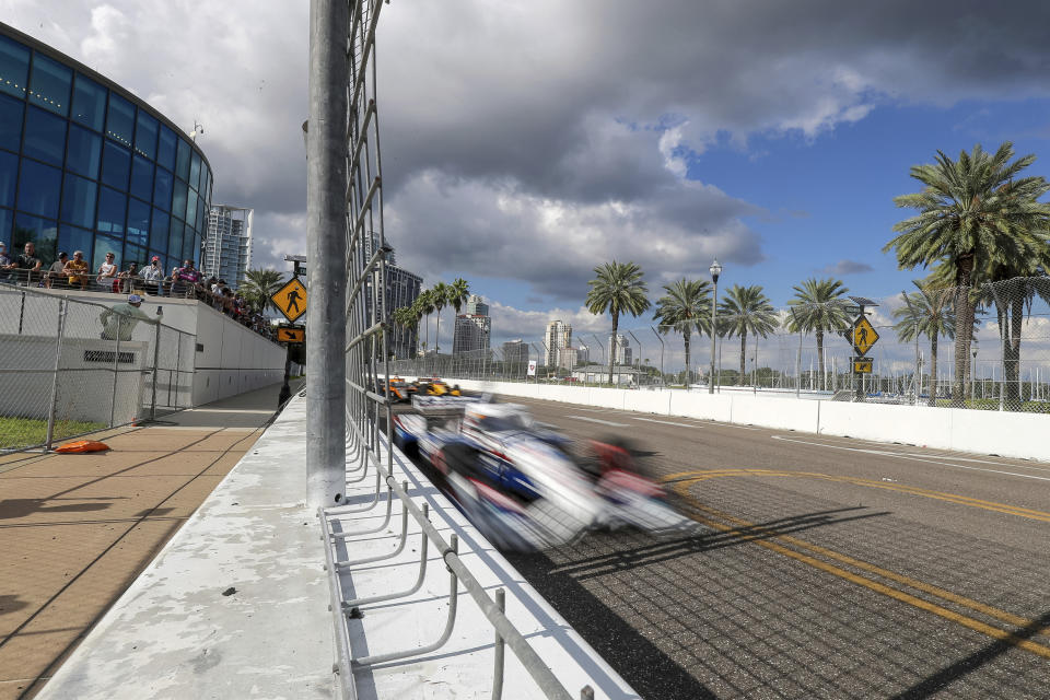 Fans watch an IndyCar auto race Sunday, Oct. 25, 2020, in St. Petersburg, Fla. (AP Photo/Mike Carlson)