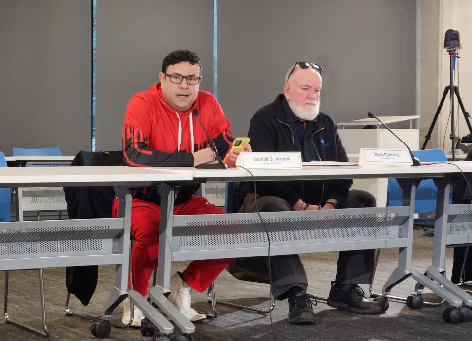 Gambit S. Aragon, III, left, delivers remarks during the December meeting of the Columbus Civilian Police Review Board, which voted to recommend his removal.