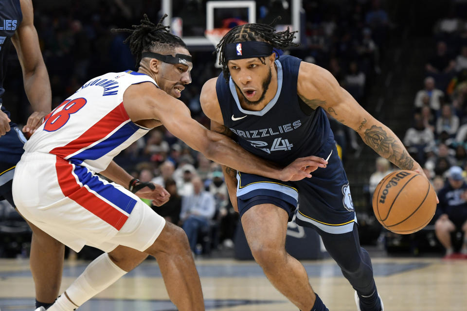 Memphis Grizzlies forward Lamar Stevens (24) drives against Detroit Pistons forward Tosan Evbuomwan (18) in the second half of an NBA basketball game Friday, April 5, 2024, in Memphis, Tenn. (AP Photo/Brandon Dill)