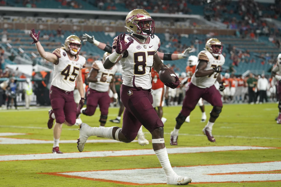 Florida State tight end Camren McDonald (87) celebrates after scoring a touchdown during the second half of an NCAA college football game against Miami, Saturday, Nov. 5, 2022, in Miami Gardens, Fla.(AP Photo/Lynne Sladky)