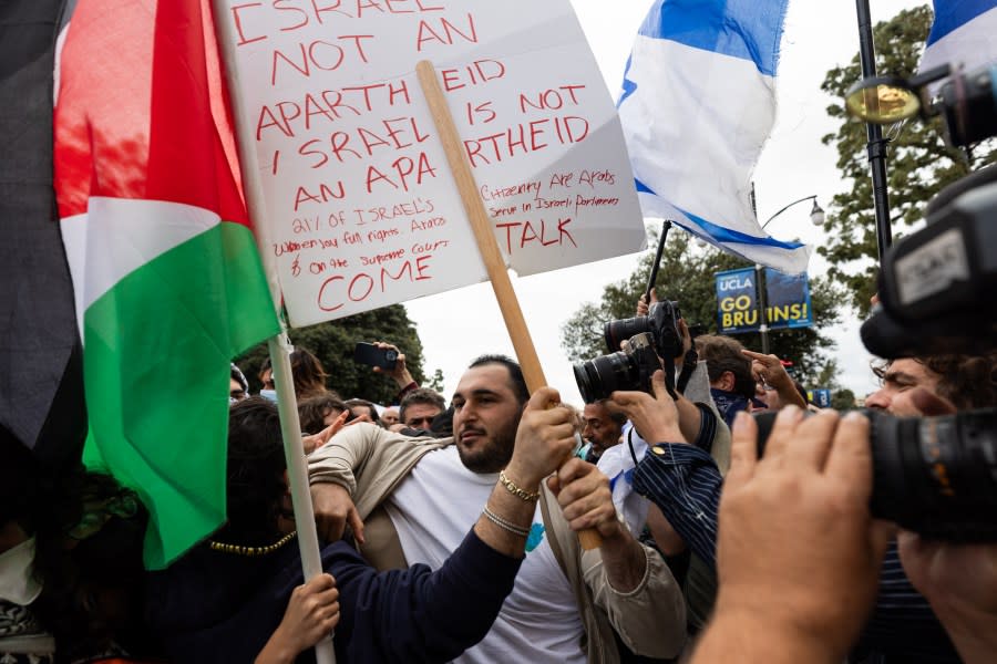 LOS ANGELES, CA – APRIL 25: Pro-Palestinian demonstrators and Pro-Israel demonstrators clash with each other on the campus of the University of California Los Angeles (UCLA) on April 25, 2024 in Los Angeles, California. Students protesting on campuses across US ask colleges to cut investments supporting Israel. (Photo by Qian Weizhong/VCG via Getty Images)