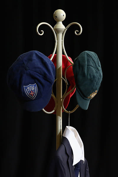 Hughes' Baggy Green and State cricket caps are displayed at the funeral.