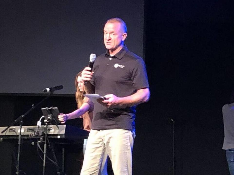 Pastor John Reeves of Lexington’s Radius Church leads prayers for the recovery of the Smith family Thursday after they were injured in a car crash in Hawaii.