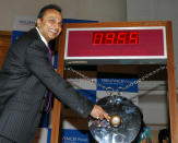 Chairman of India's Reliance Power Anil Ambani sounds a gong at a ceremony to mark the listing of the company at The Bombay Stock Exchange (BSE) in Mumbai on February 11, 2008. Reliance Power, which managed a record initial share offer last month, fell as much as 13.5 percent in its debut on Indian bourses on concern about the global economic outlook. After a brief gain to 599 Indian Rupees (USD 15.08), it quickly fell to as low as 389 Indian Rupees (USD 9.80) on the exchange. Reliance Power aims to build a dozen major power plants in the next decade in India and had snapped up 2.9 billion USD in an eagerly subscribed initial share sale in January 2008, priced at 450 Indian Rupees (11.54 dollars). AFP PHOTO/Sajjad HUSSAIN