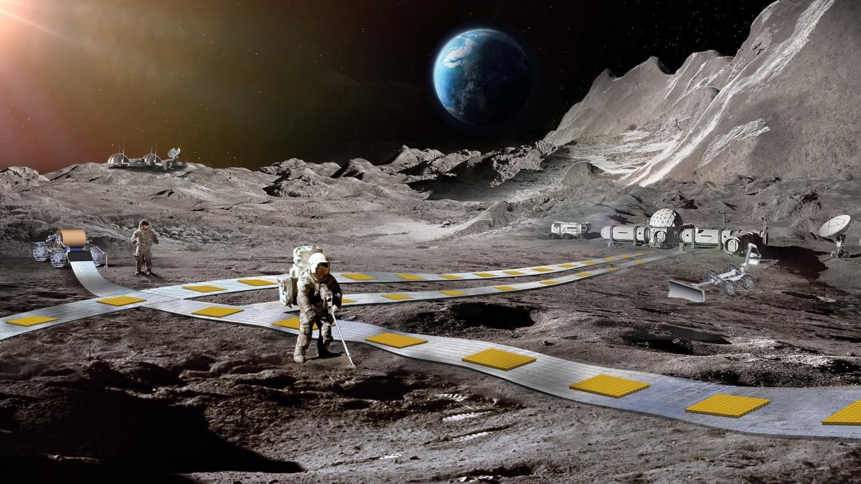 Concept art of lunar base with floating train path alongside astronauts