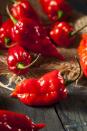 <p>The hottest peppers get the scariest names. The ghost pepper comes from northeast India and is 100 times hotter than a jalapeño. You will find it in the <a href="https://www.delish.com/food/g27320819/hottest-hot-sauces/" rel="nofollow noopener" target="_blank" data-ylk="slk:hottest hot sauces;elm:context_link;itc:0;sec:content-canvas" class="link ">hottest hot sauces</a> and in some super spicy chutneys and curries. </p><p>"Although this pepper is known for its heat, it does present layers of flavor that are expressed in different ways when pounded, sliced, or fermented," Schueller said.</p><p>Scoville heat units: 1,000,000+</p>