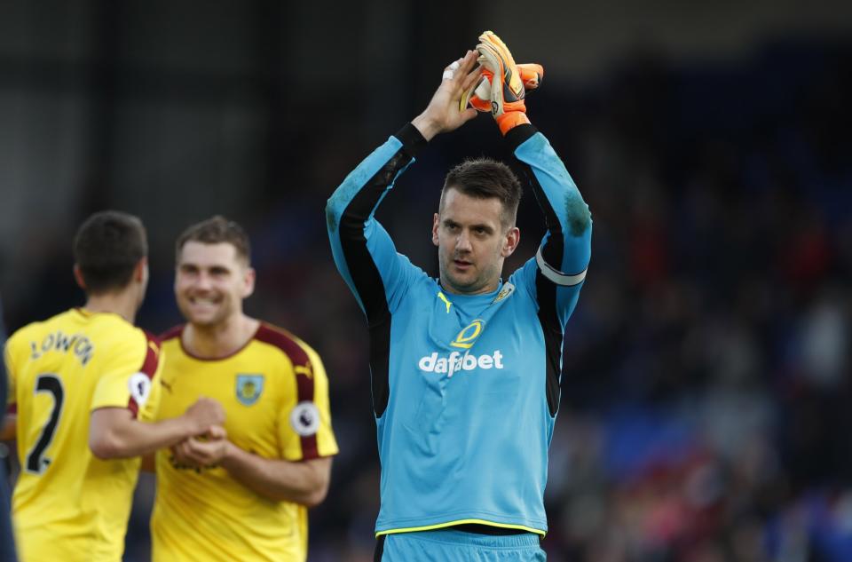 <p>Burnley’s Tom Heaton celebrates after the game </p>
