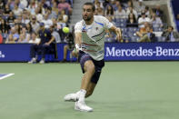 Marin Cilic, of Croatia, returns a shot against Rafael Nadal, of Spain, during the fourth round of the U.S. Open tennis tournament Monday, Sept. 2, 2019, in New York. (AP Photo/Seth Wenig)