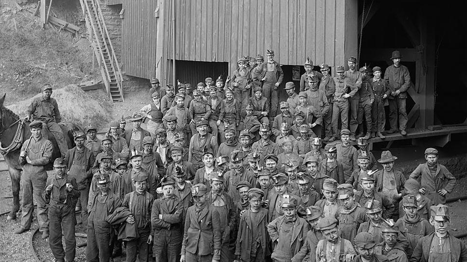 Mining companies used to employ child workers, called "breaker boys," to break large lumps of coal into smaller pieces and remove impurities. These young workers were photographed in the late 1800s in Kingston, Pennsylvania. - Library of Congress